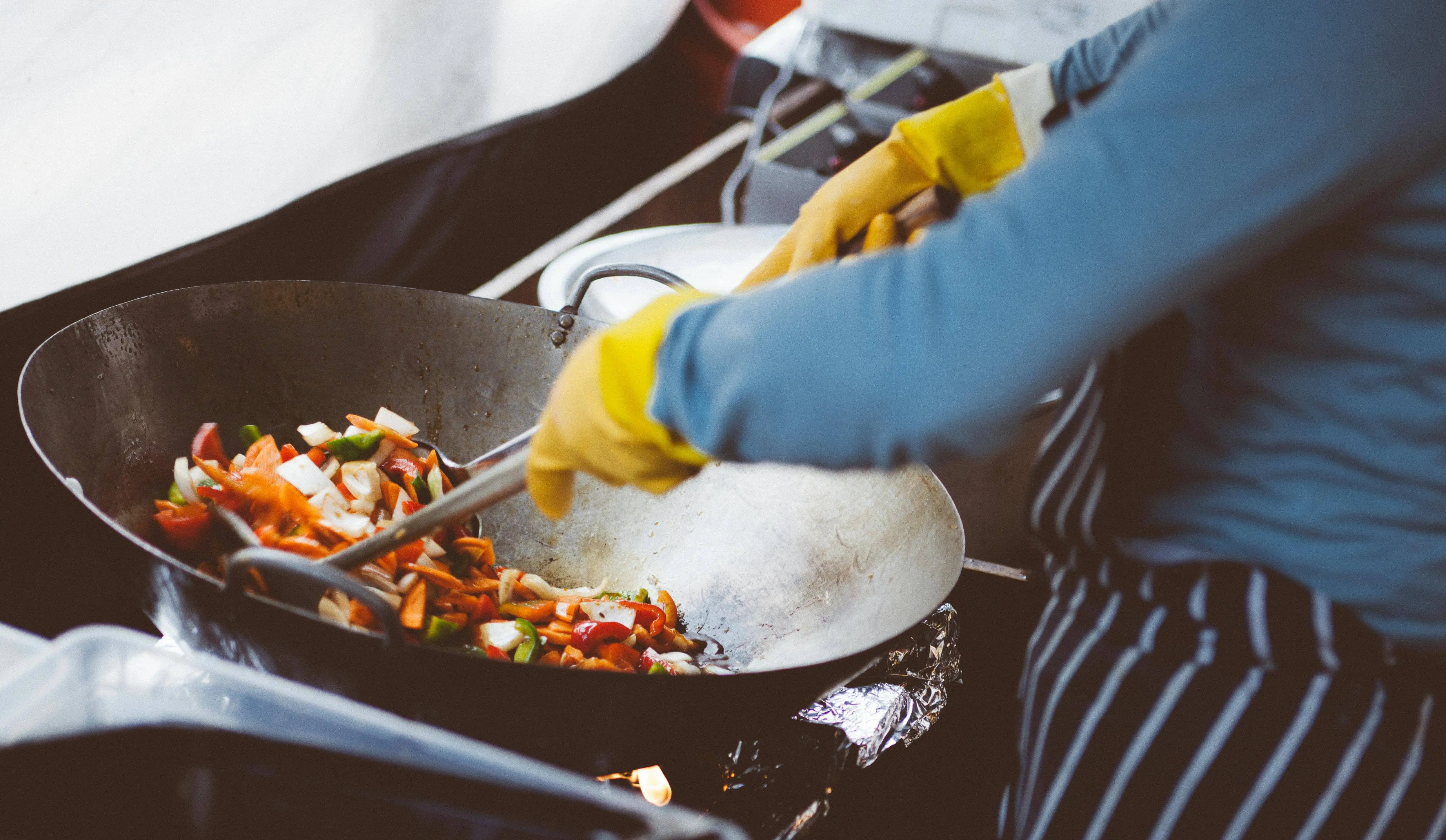 Person cooking in a kitchen